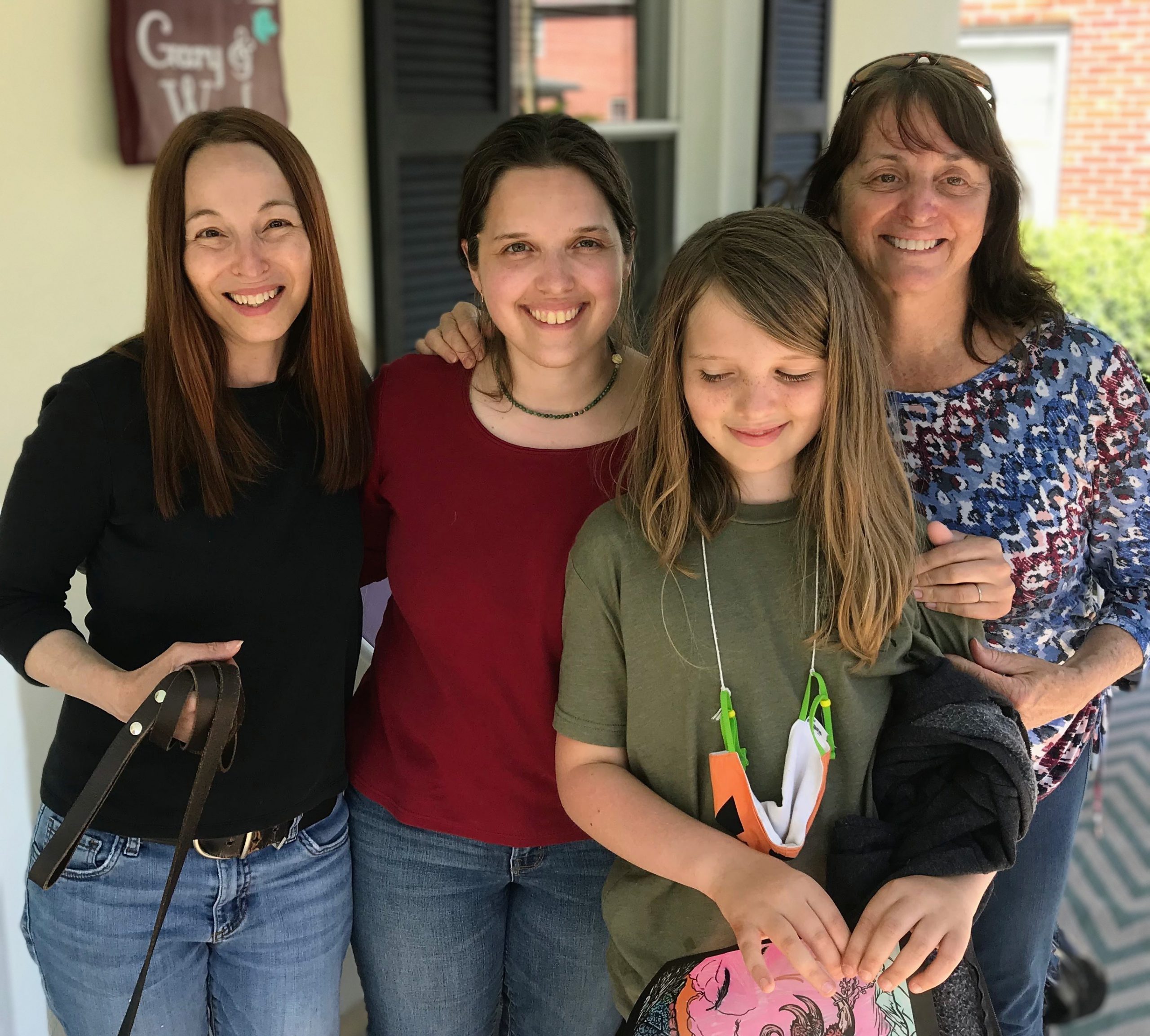 A posed group photo of Marta, Aili, Silas, and Wendy (Grammie)