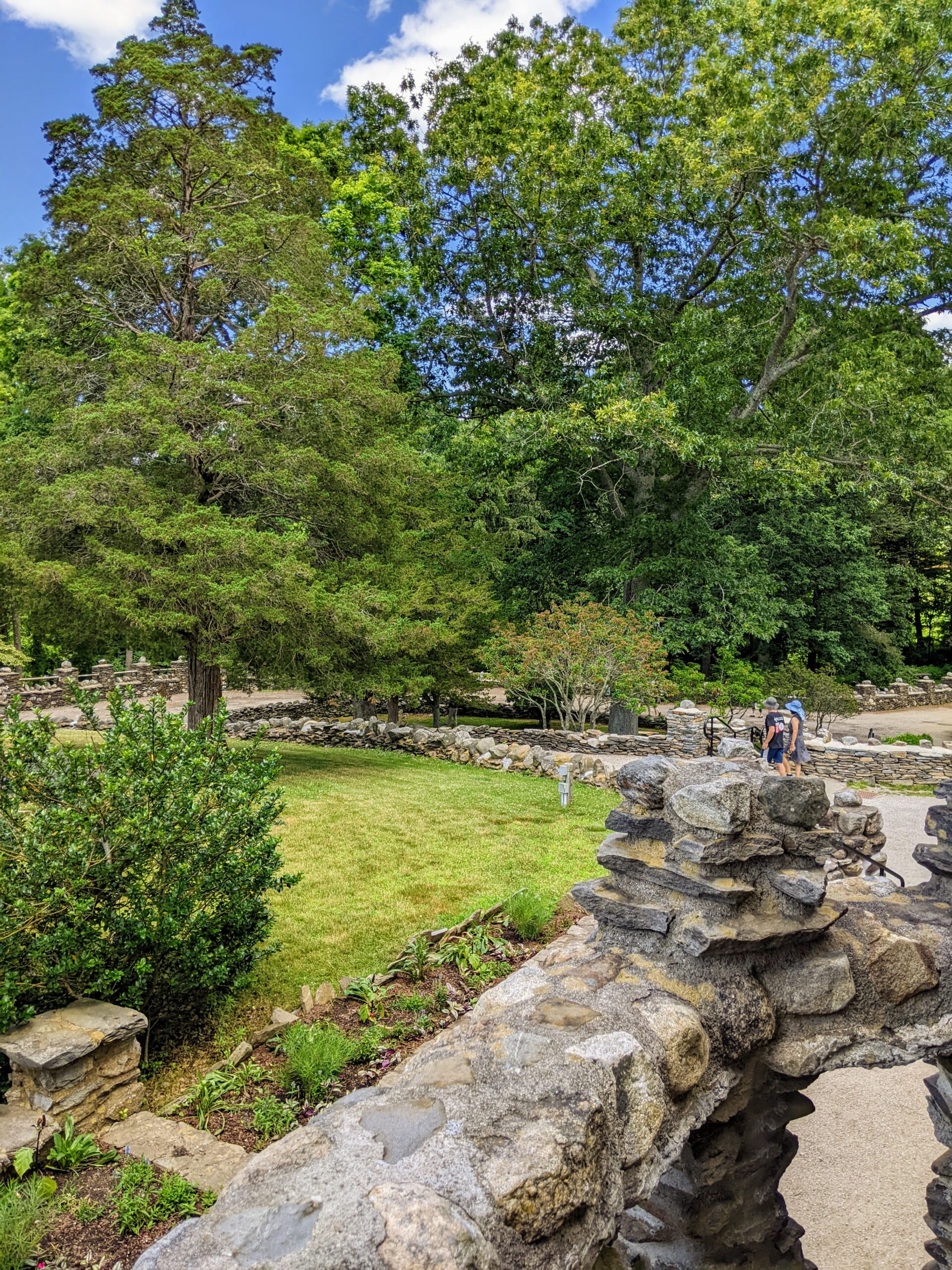 Trees, grass, stone walls