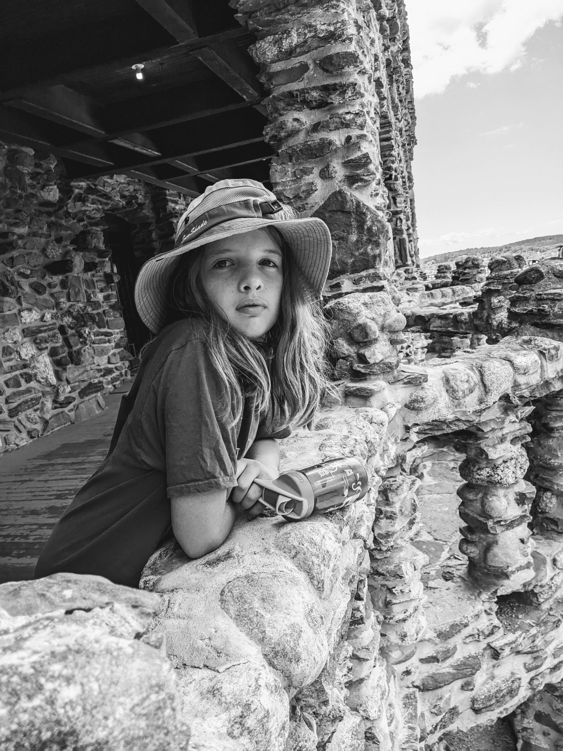 Silas leaning over the castle wall