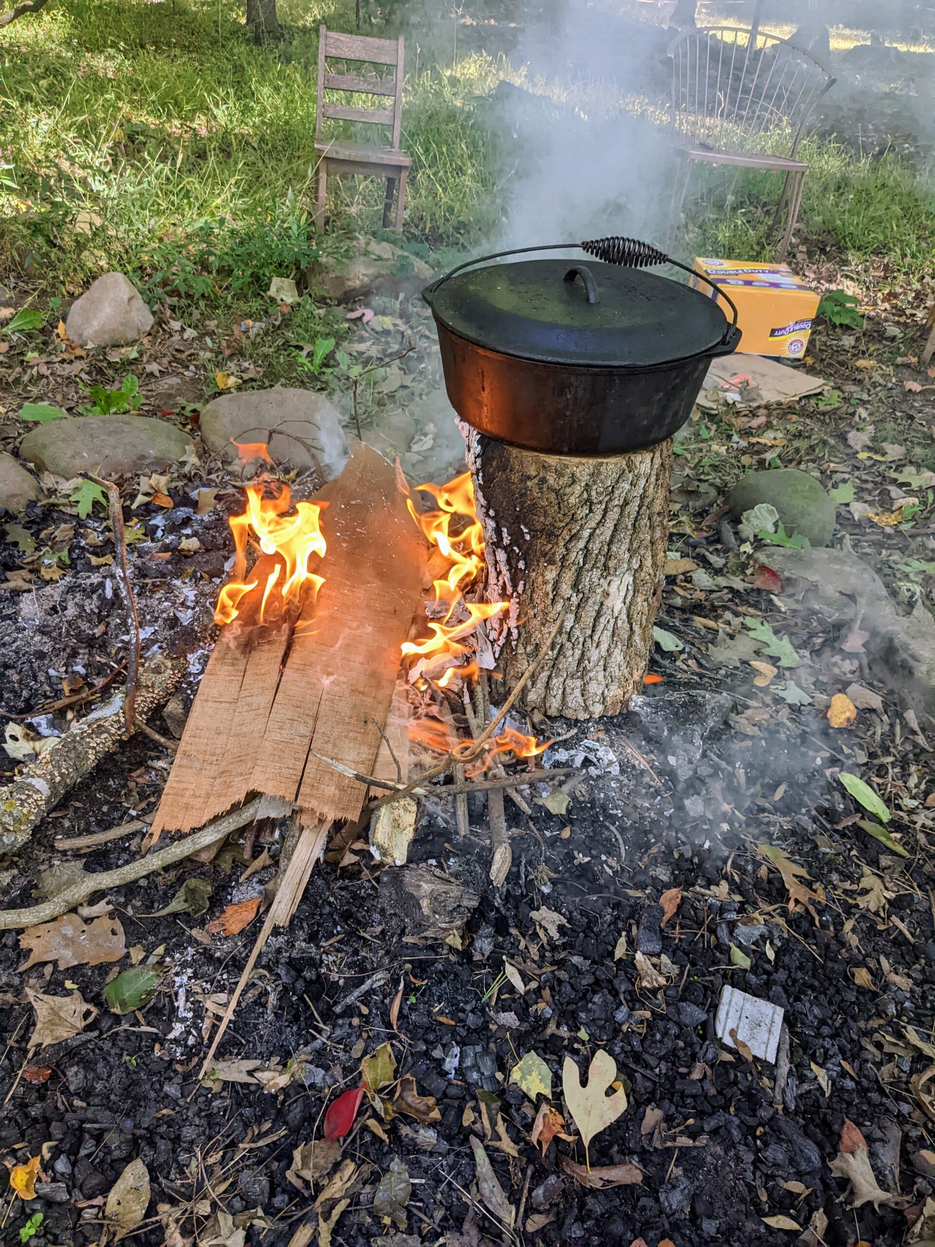 Outdoor fire with steaming cauldron