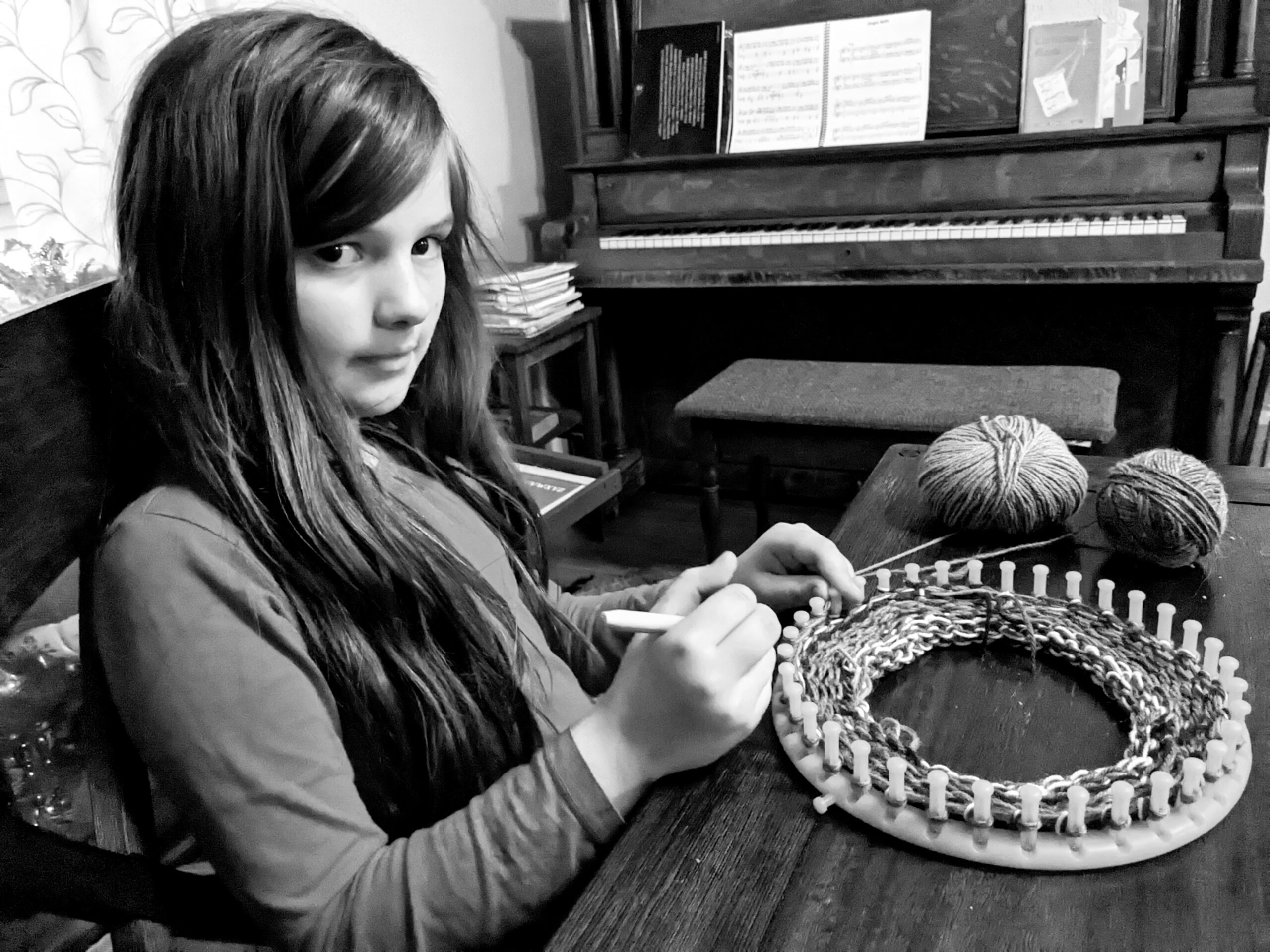 Petra making a hat on a circular knitting loom