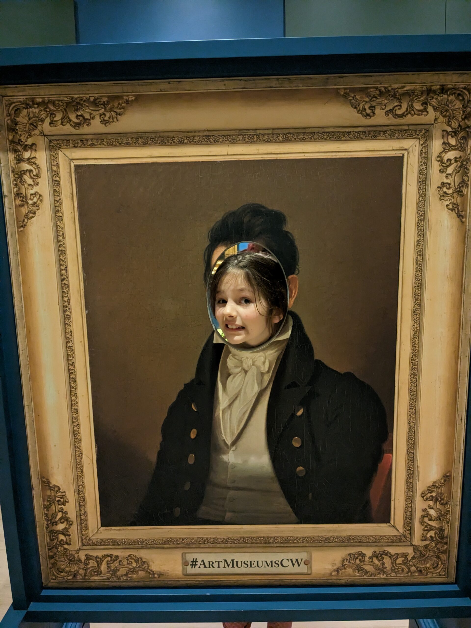 Petra in one of those "put your face in the picture" photo ops--the picture is a portrait of a colonial man