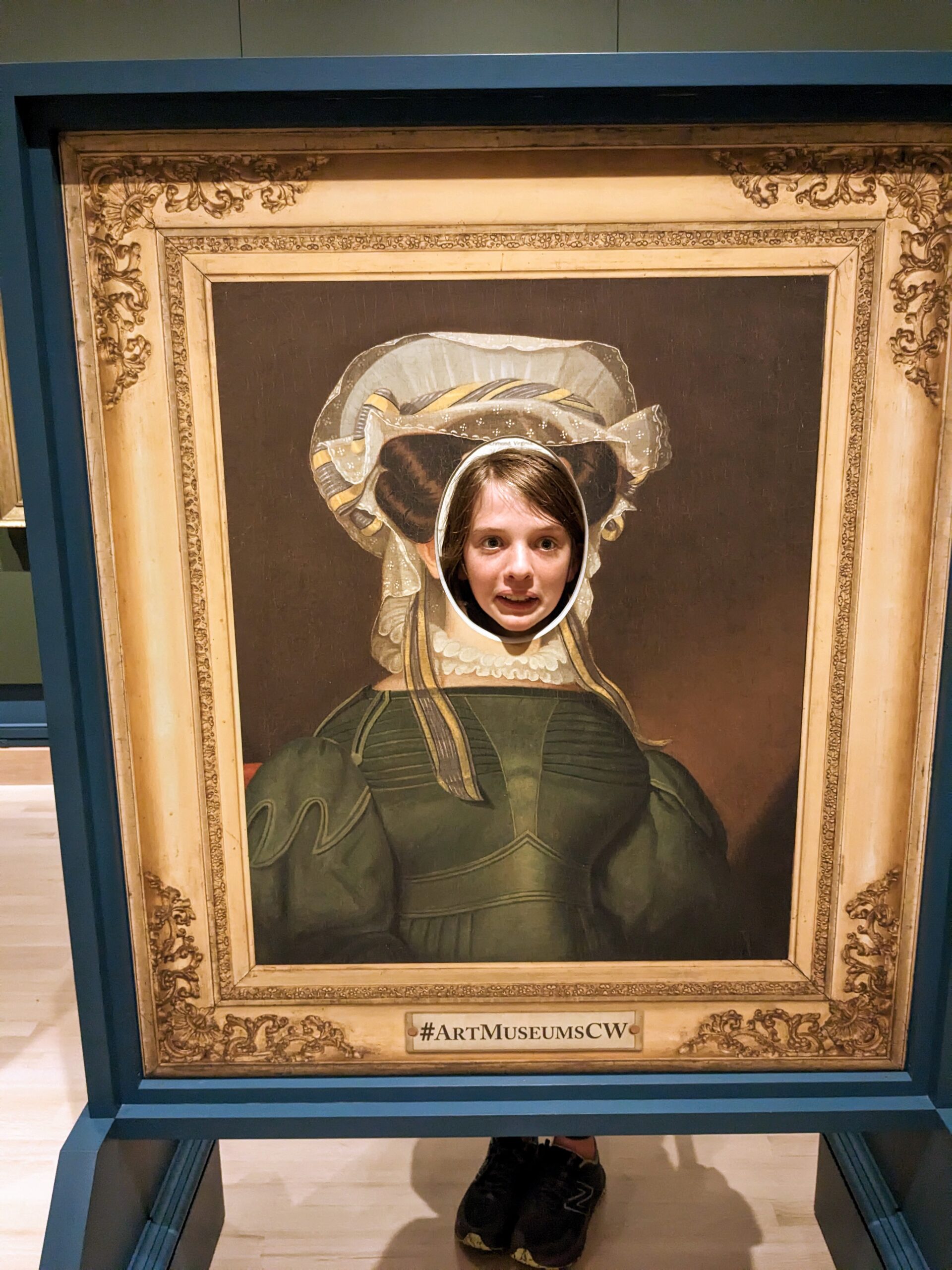 Silas in one of those "put your face in the picture" photo ops--the picture is a portrait of a colonial woman