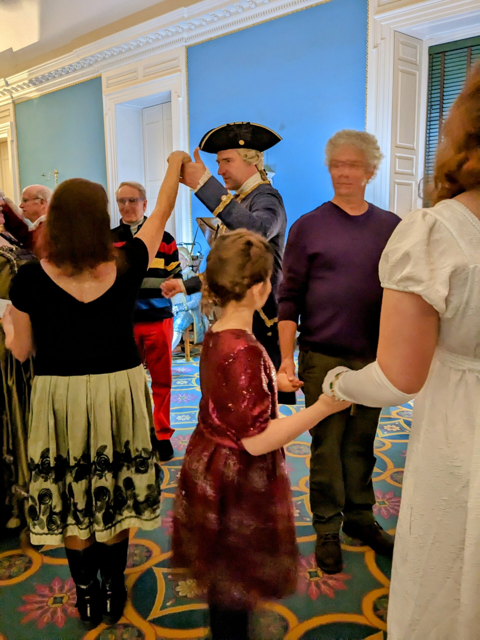 Several people, including Wendy, Petra, and Gary are lined up for a dance.