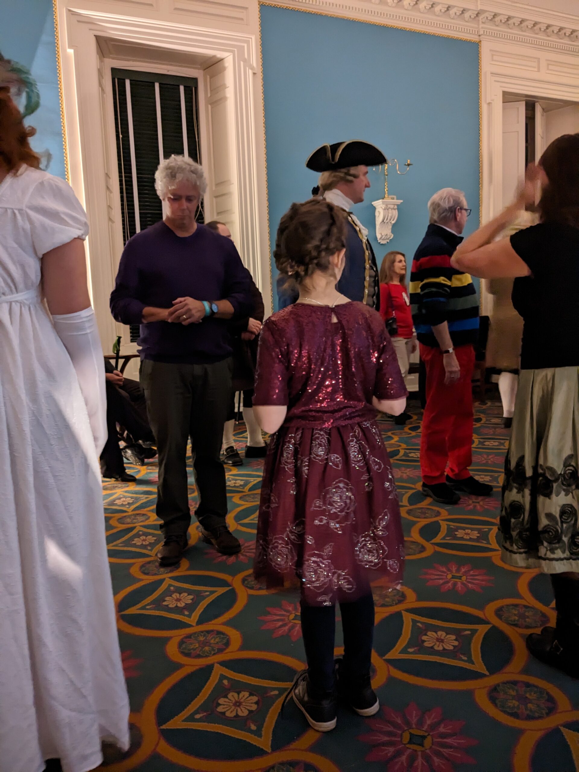 Several people, including Wendy, Petra, and Gary are lined up for a dance.