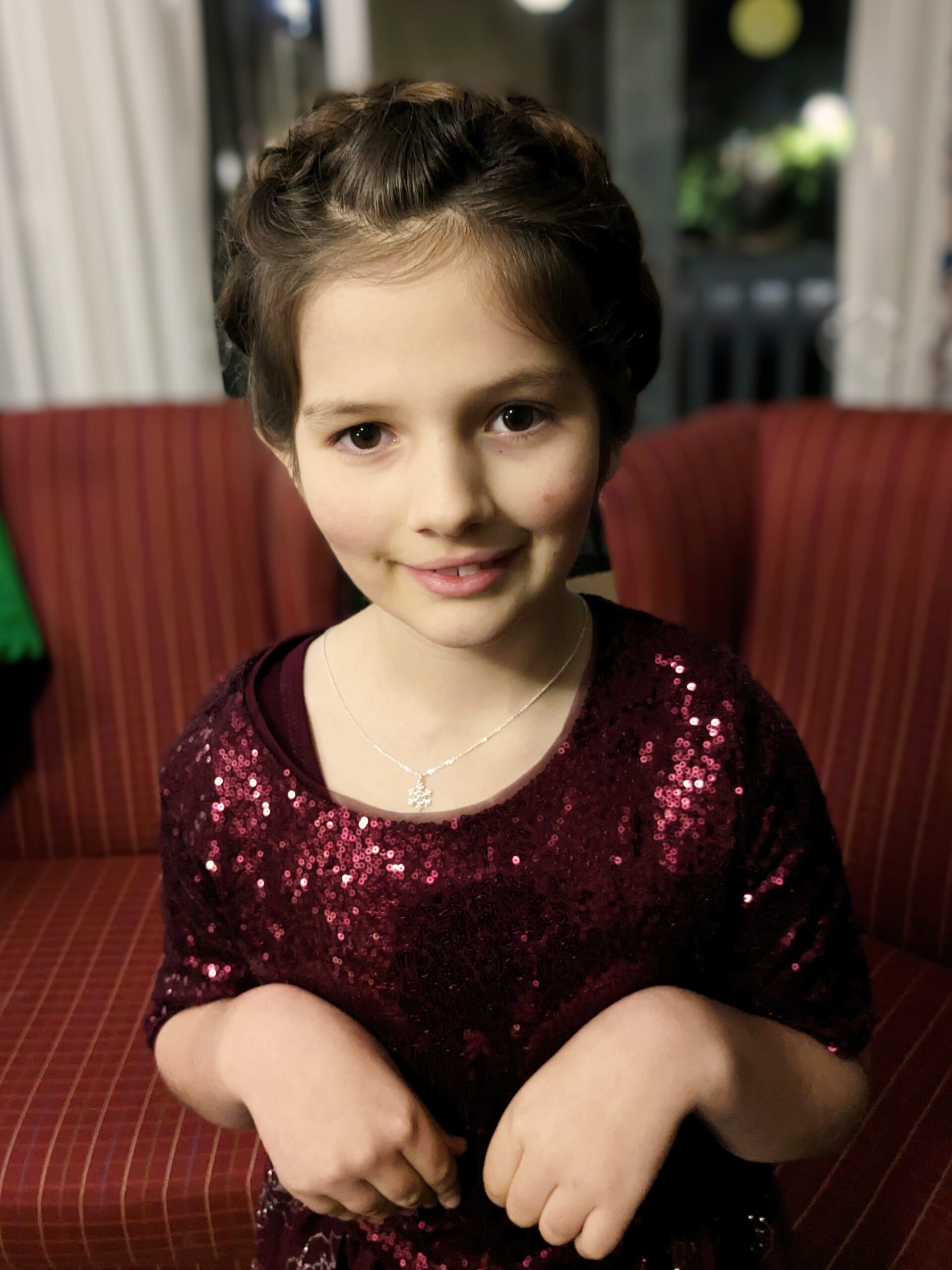 Petra, portrait, wearing a purple sparkly dress.
