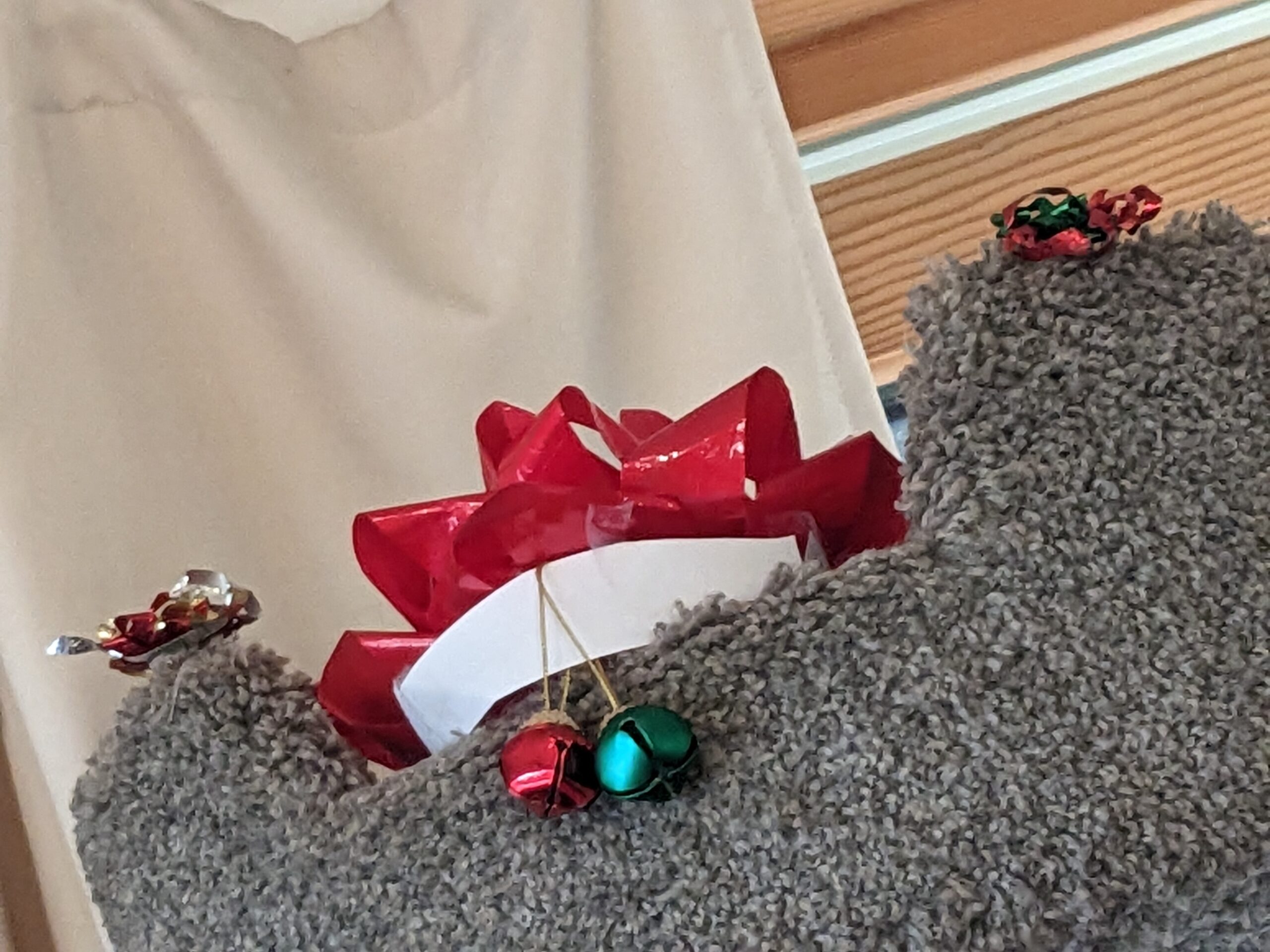 Ribbons and bells on a cat tree